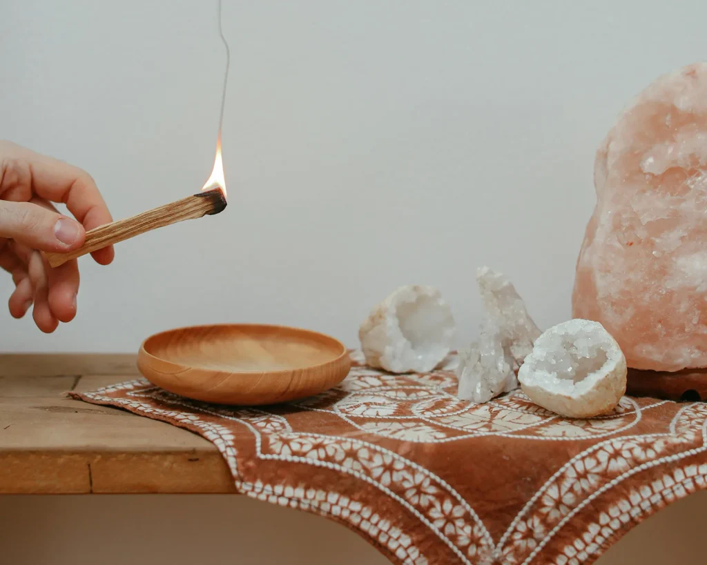 Image of hand burning palo santo